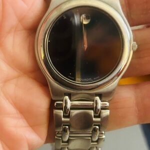 Movado Black and Silver Watch. Refinement and Polished look. Needs battery as is